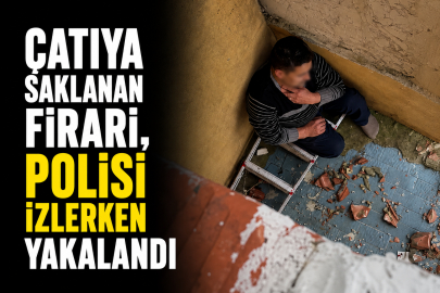 Çatıya saklanan firari, polisi izlerken yakalandı